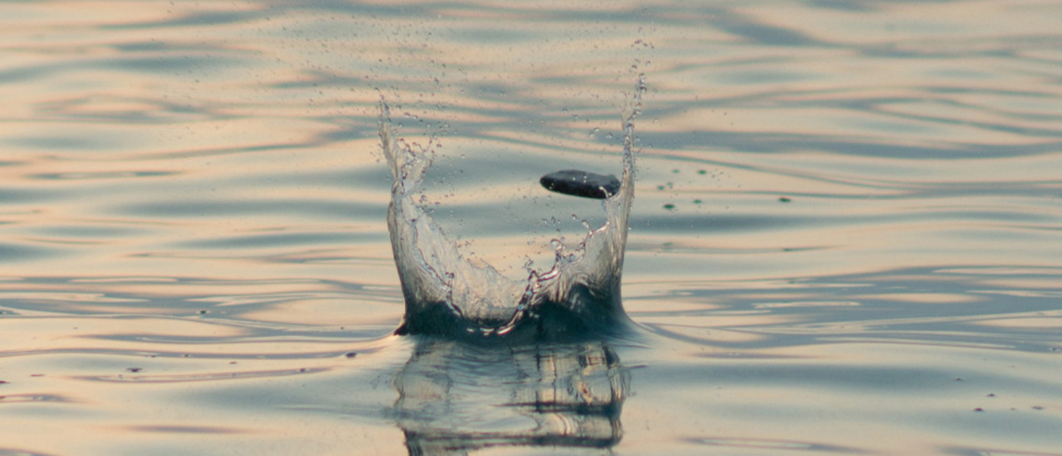 A Single stone skipping across the water
