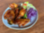 Plate of gluten-free, Vietnamese chicken wings with sweet and sour sauce and lettuce and purple cabbage salad. Pho88 Bend, Oregon
