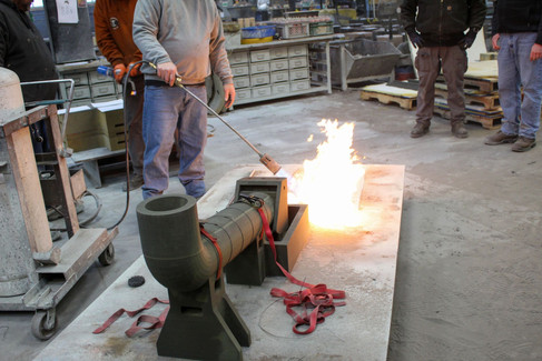 Molten steel being poured into sand mold for competition sword at Trumbull Foundry