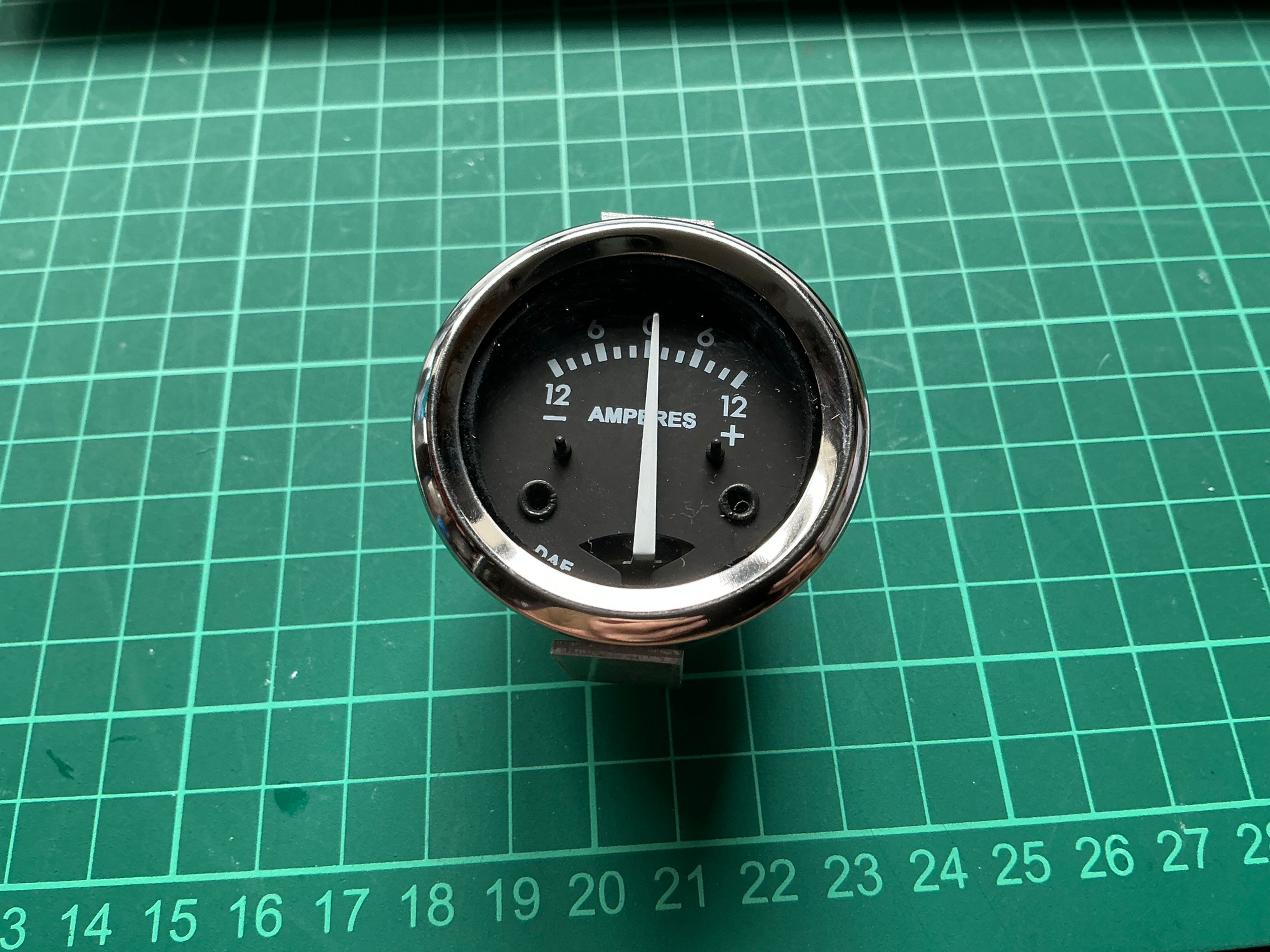 Metal Cased -12-0-12+ Black Faced Ammeter. 18999.