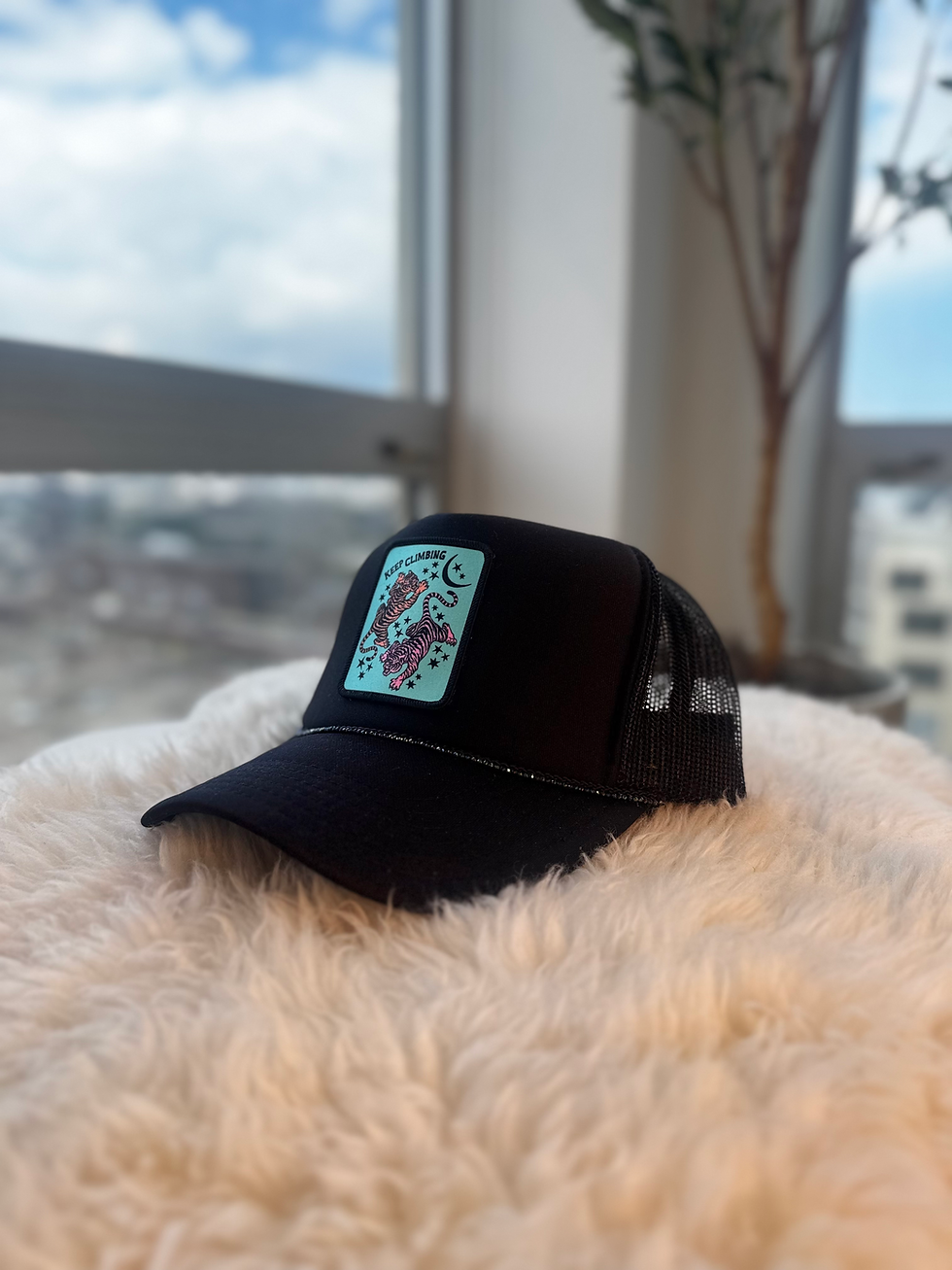 Black trucker hat with vintage “Keep Climbing” patch and crystal bead detail – front view
