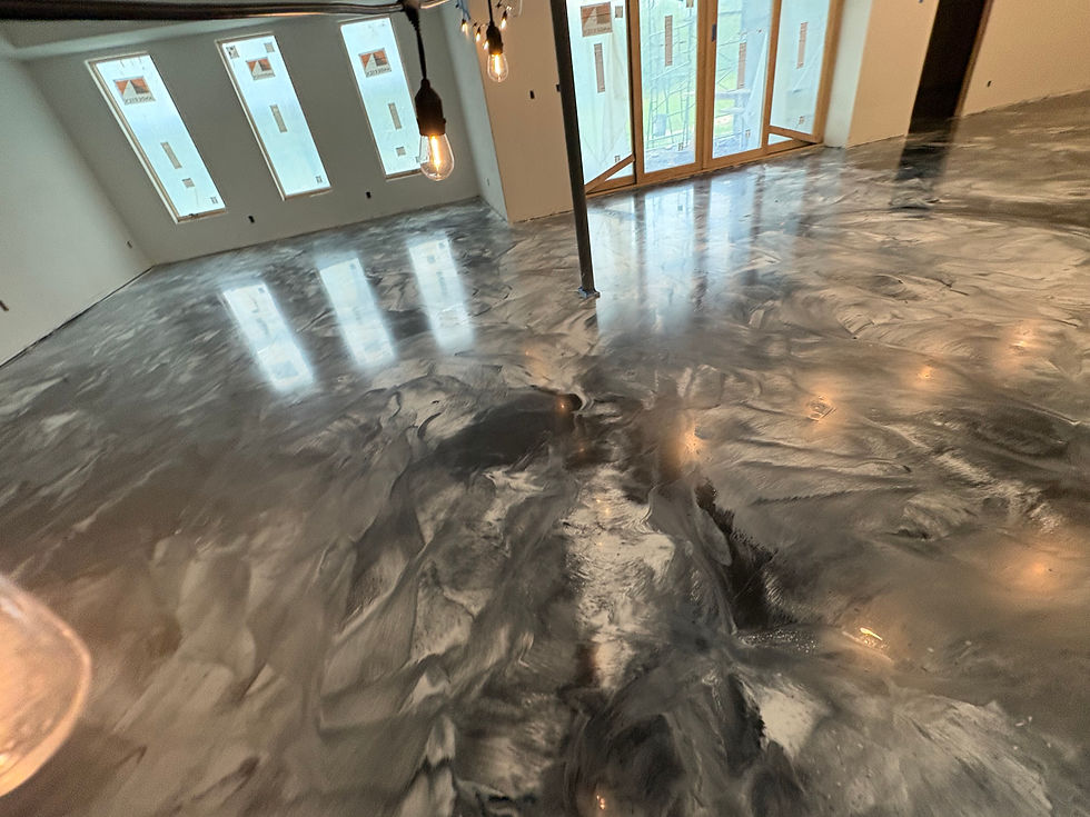 Metallic epoxy basement floor after coating — first angle showing finished result, Combs Custom Concrete