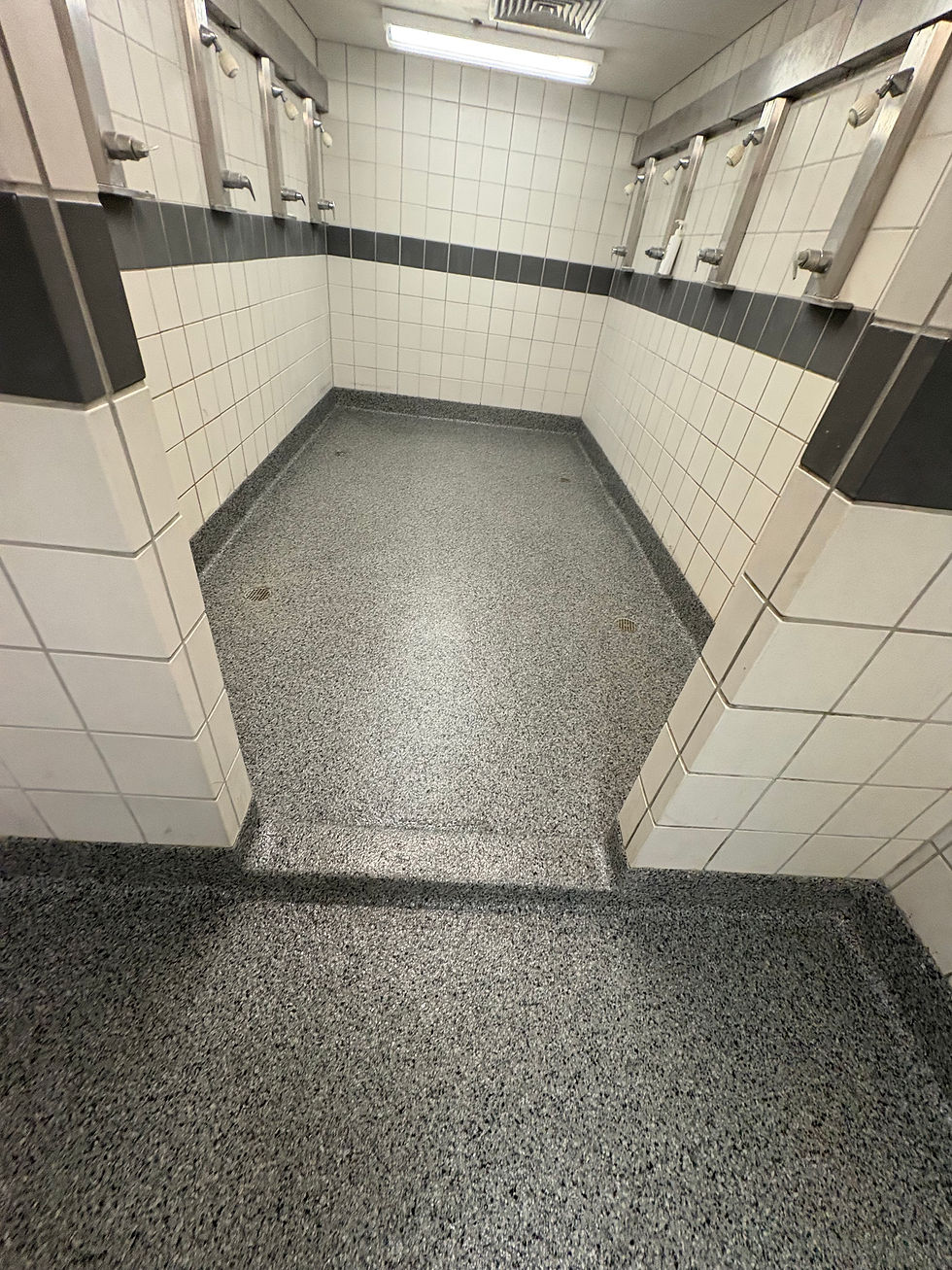 Drury University locker room shower floor after decorative coating — Combs Custom Concrete