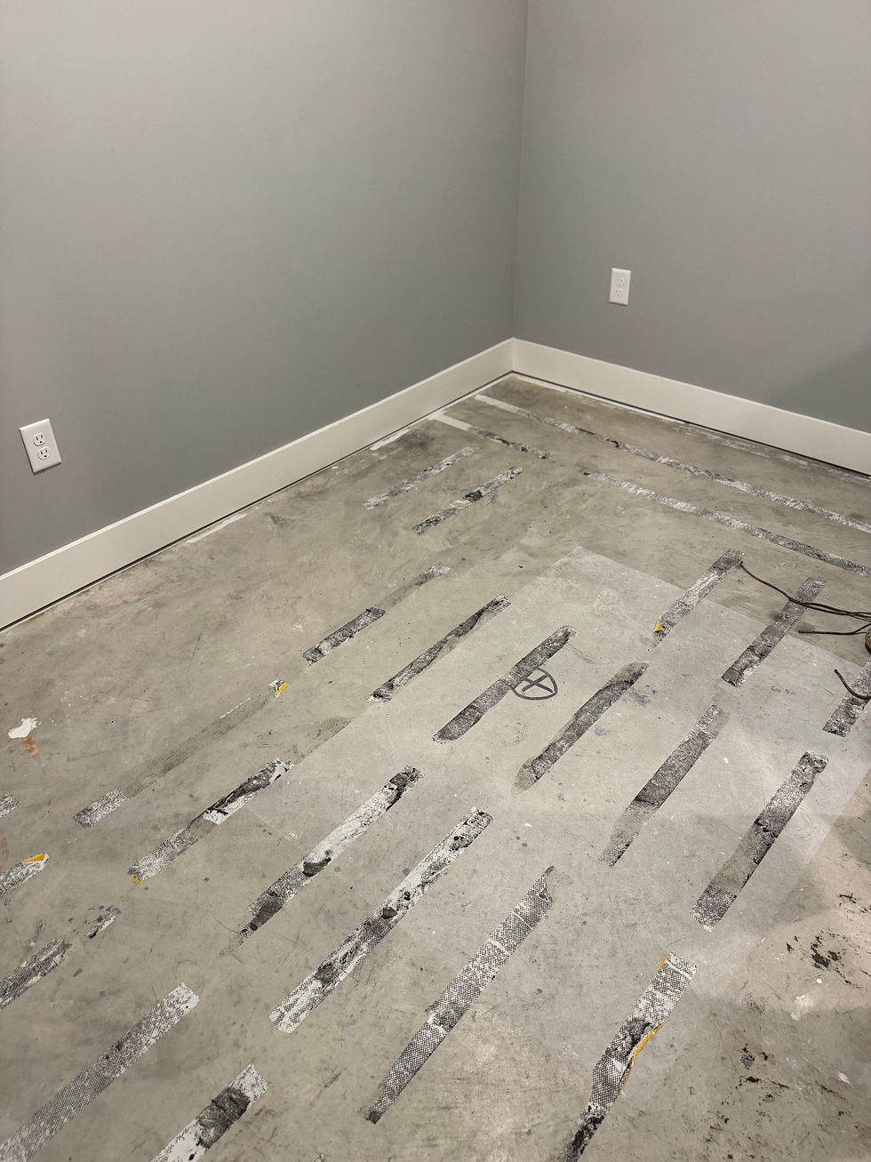 Interior room floor before solid gray epoxy coating — second angle, Combs Custom Concrete