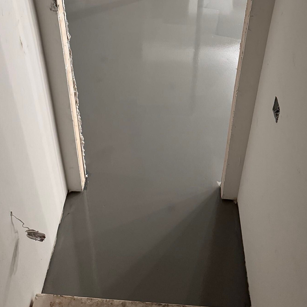 Metallic epoxy basement floor before coating — third angle, Combs Custom Concrete