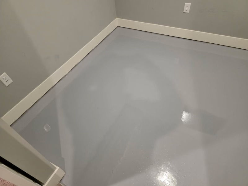 Interior room floor after solid gray epoxy coating — second angle finished result, Combs Custom Concrete