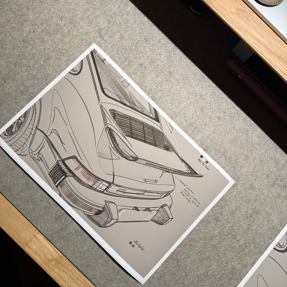 Whale Tail Study 12x16 automotive art print shown on a desk for scale, featuring a Porsche 911 whale tail sketch printed on a