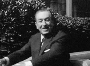 Walt Disney smiling at the camera