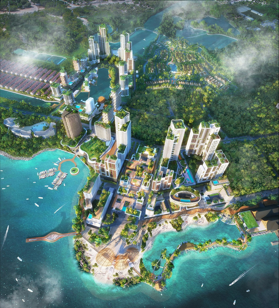 A rendering showing a birds eye view of a coastal urban development project featuring towers, a beach, a lagoon and many boats.