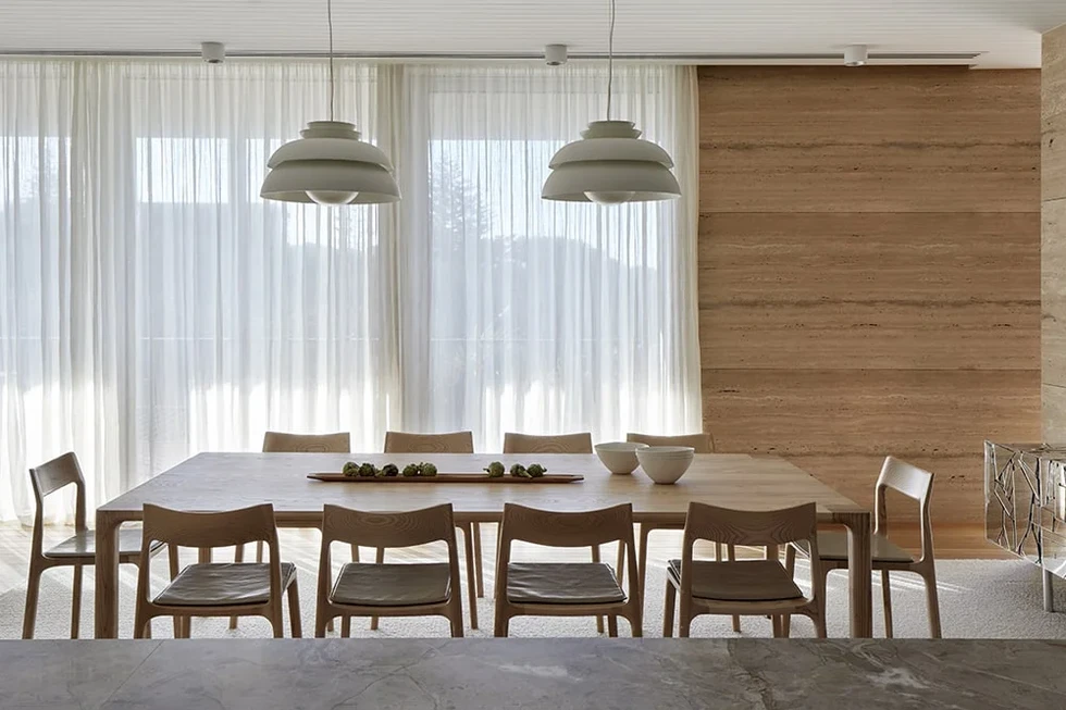 Dining Room with wood dining set inside Sand Dune Sanctuary by Hindley & Co.