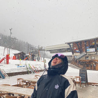 girl catching snow on tongue 