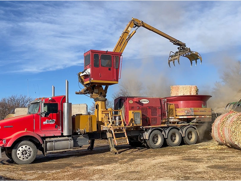 Grinding cornstalks.