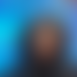 Image of Teryn with a black blazer and "the Tracee" hairstyle.