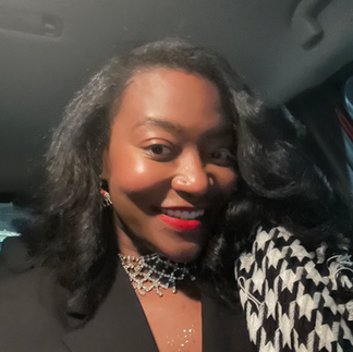 Image of Teryn with a press-n-curl and a black and white houndstooth scarf.