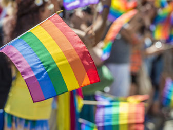 How can San Diego improve the pre-migration conditions of LGBTQI+ international migrants?