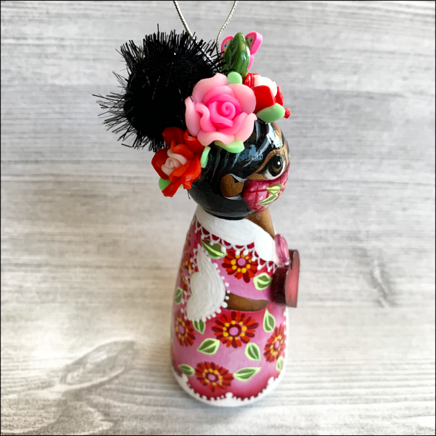 Thumbnail: Frida in Pink Mask with Heart Ornament
