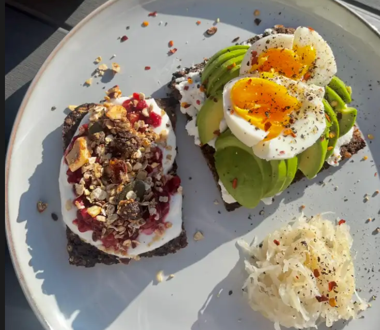 Yoghurt, berry compote and homemade granola plus avo and egg with cottage cheese