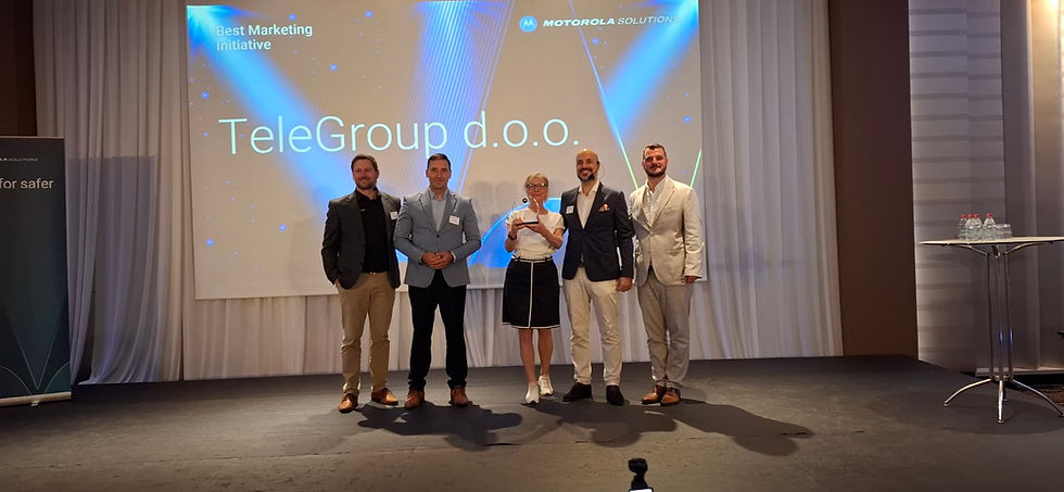 Motorola representatives presenting an award to TeleGroup representatives at an event in Izmir