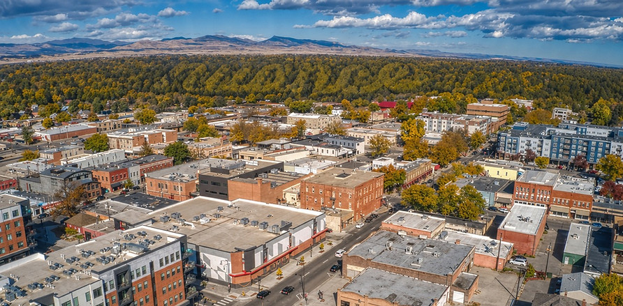Loveland CO aerial view of the town with the Nuance logo hidden in the forest above
