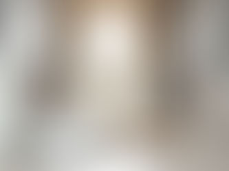 running shoes next to front door in hallway