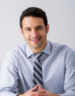 Man Sitting with a Tie