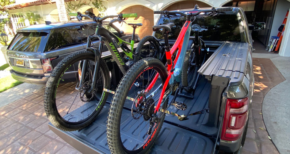 Two RIDE88 QR3 Truck Bed Bike Racks installed in a truck bed with mountain bikes mounted.