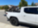 Two RIDE88 QR3 Truck Bed Bike Racks holding mountain bikes in a Rivian R1T truck bed
