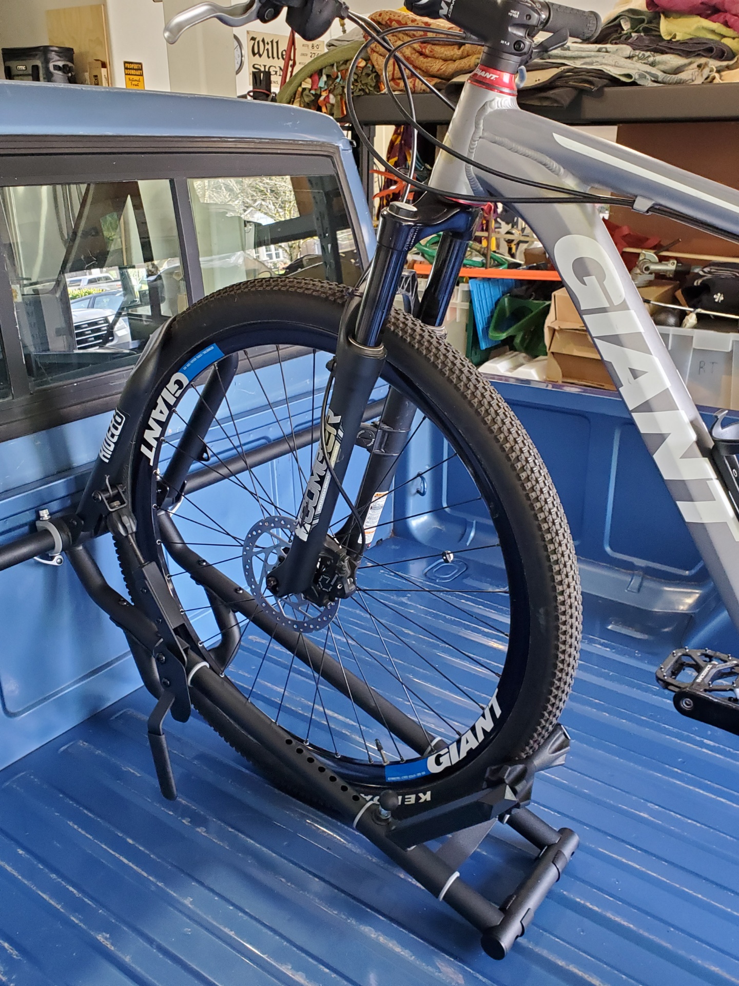 RIDE88 truck bike rack installed in a pickup truck holding a mountain bike.