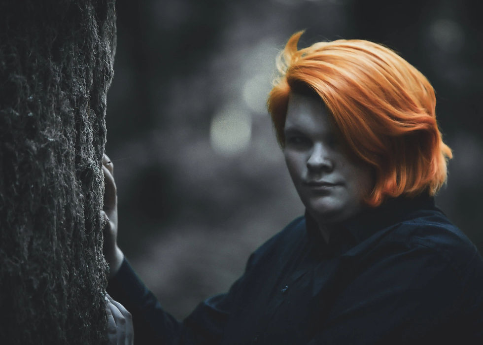 Cinematic portrait photography in the Pacific Northwest featuring dramatic natural lighting, moody tones, and authentic storytelling realism by Portland photographer Shayne Blaylock.