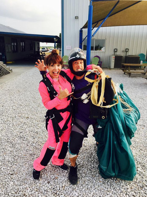 Janie Terrazas in a pink jumpsuit after skydiving