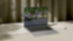 Silver laptop propped up by white wooden board with sage colored curtains in the background. On the screen is a property management group's website designed by small business website designer, Skunk Hill Creative.