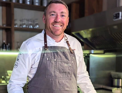 Chef Justin Jennings, World Cook Champion, creating fusion cuisine in Lisbon.