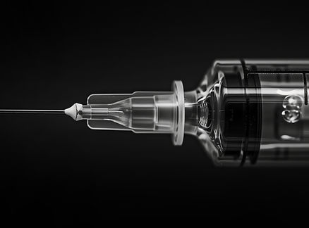 vecteezy_ai-generated-syringe-with-a-needle-background-ideal-for_43102956.jpeg