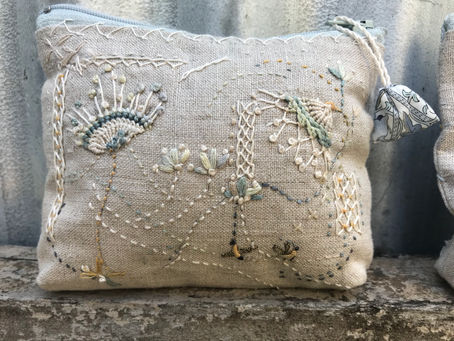 Stitch it as you like...image from our Rambling stitch purse kit...Jo stitches the zips in place for you...we add some little pre prints and scraps etc and some guidance on this Rambling stitch style.