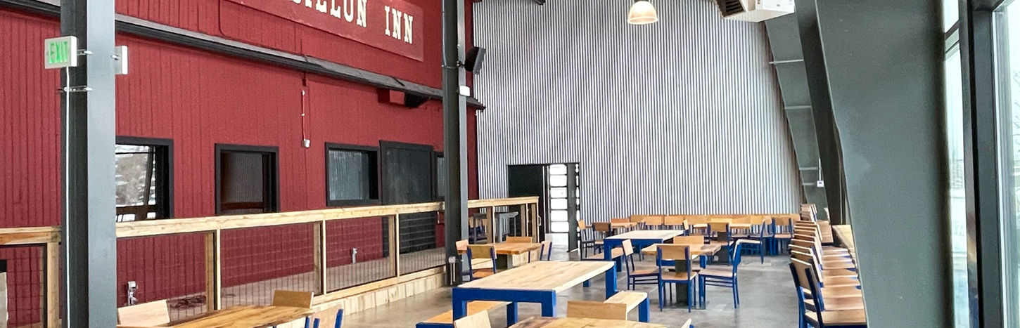 Old Dillon Inn interior with wooden tables and blue chairs