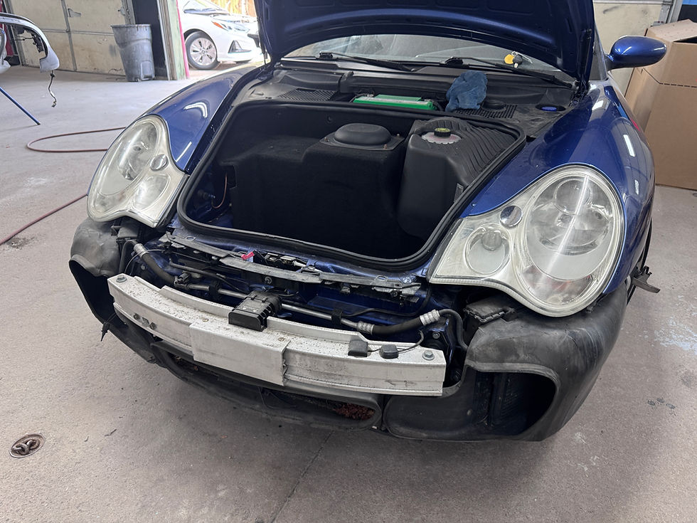 Damaged vehicle in Denver after collision, showing front-end damage