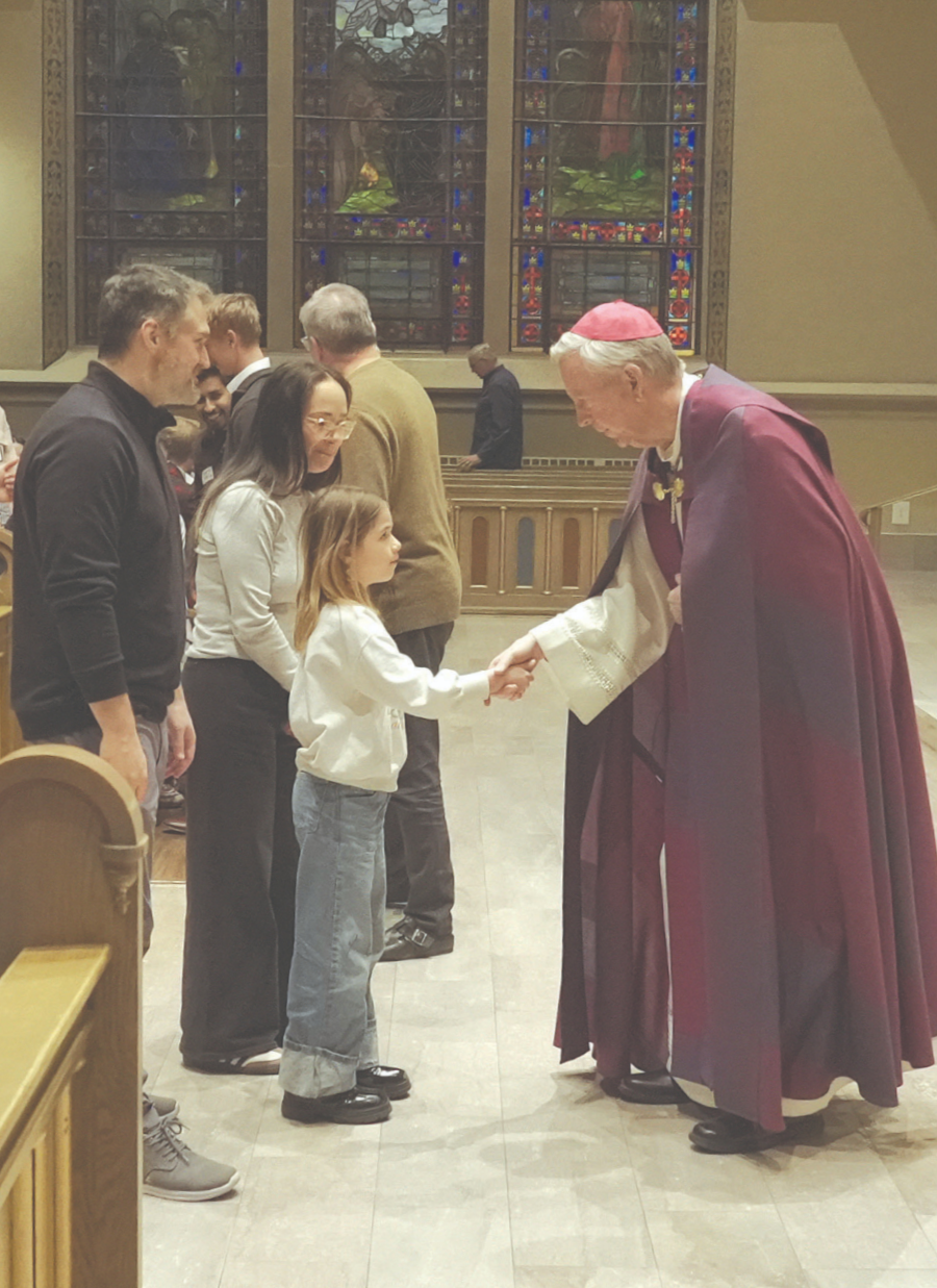 Bishop Peter F. Christensen greets a family of Candidates at the Rite of Election at the Cathedral of St. John the Evangelist in Boise. (ICR photo/Emily Woodham)