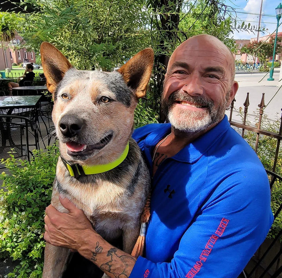 Smiling personal trainer in Chattanooga with his dog