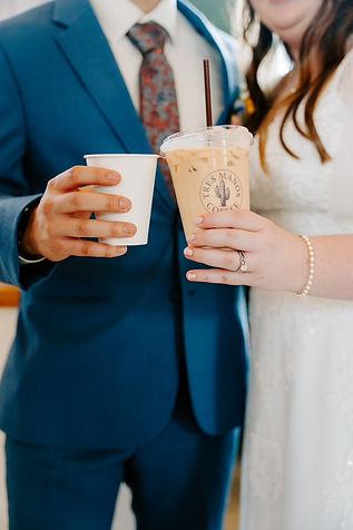 Married couple with coffee cups in their hands