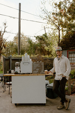 Owner next to coffee cart