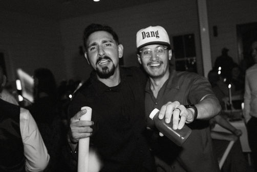 Friendly baristas serving espresso at a Waco wedding coffee event
