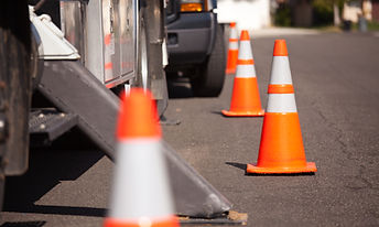 several-orange-hazard-cones-and-utility-truck-in-s-2023-11-27-05-36-50-utc.jpg