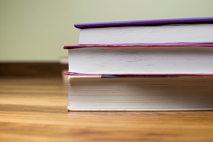 close-up-some-books-wooden-surface (1).jpg