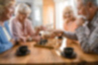 happy-mature-friends-enjoying-while-playing-chess-coffee-time-home.jpg