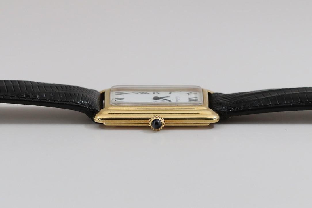 Crown Side Of 1970's 18K Yellow Gold Tank Watch Retailed By Cartier, Made By Concord