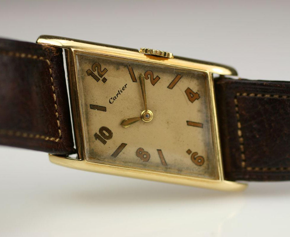 Cartier Asymmetrical Parallelogram Vintage Gold Watch Laying Across