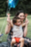 Woman holding her toddler sun and smiling, in Beech Grove Indiana