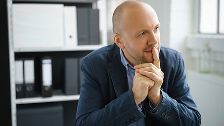Professional reviewing documents and data in an office setting