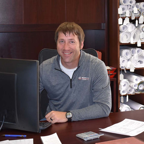 Block Iron & Supply employee working on a computer