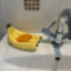 Bunch of bananas soap dish with bar of soap sitting on top